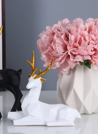 Black and White Deer Decor with White Vase and Pink Artificial Flower