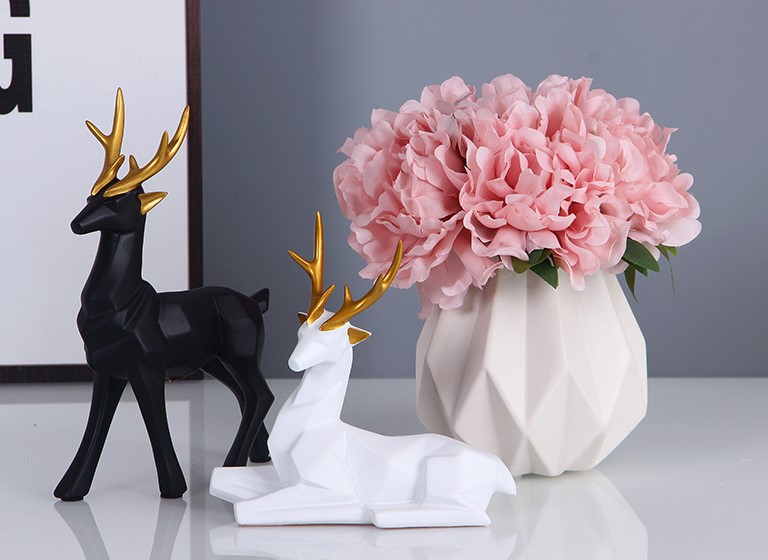 Black and White Deer Decor with White Vase and Pink Artificial Flower