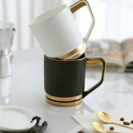 Black and Gold Cup with Lid and Gold Spoon