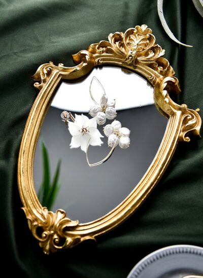 Shield-Shaped Mirror with Gold Embellishment