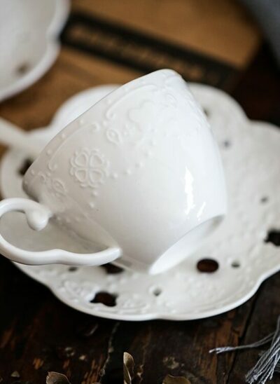 White Porcelain Coffee Cup and Saucer with Embossed Embellishment