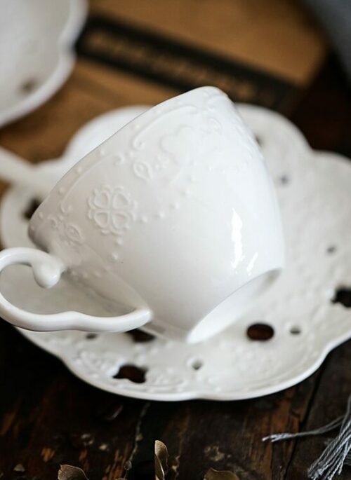 White Porcelain Coffee Cup and Saucer with Embossed Embellishment